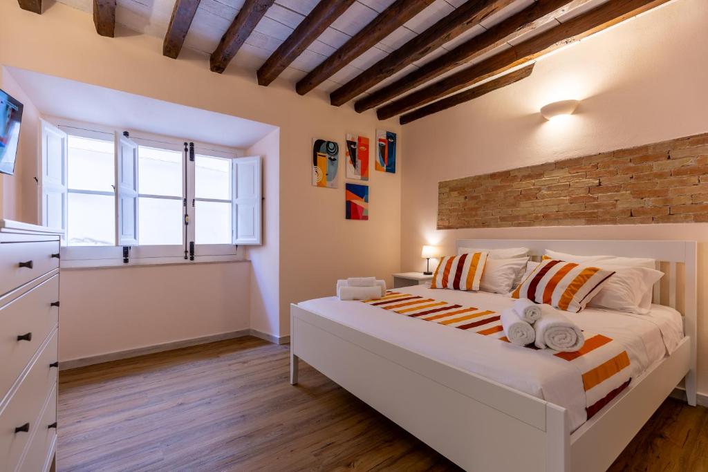 Ένα ή περισσότερα κρεβάτια σε δωμάτιο στο Casadicastello