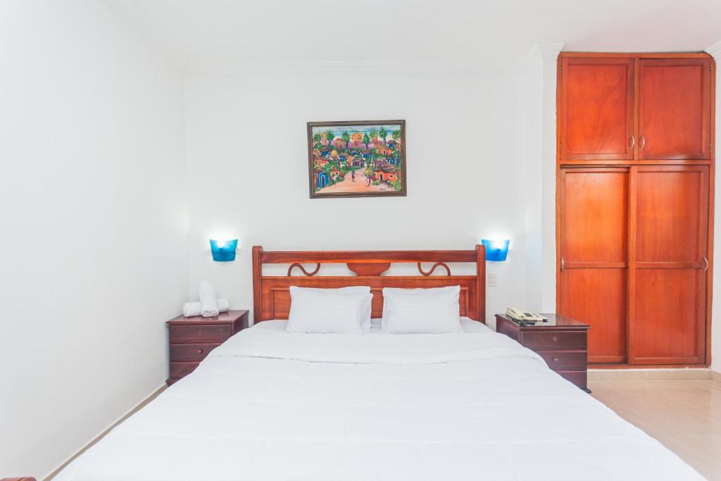 Postel nebo postele na pokoji v ubytování Hotel Baluarte Cartagena Boutique