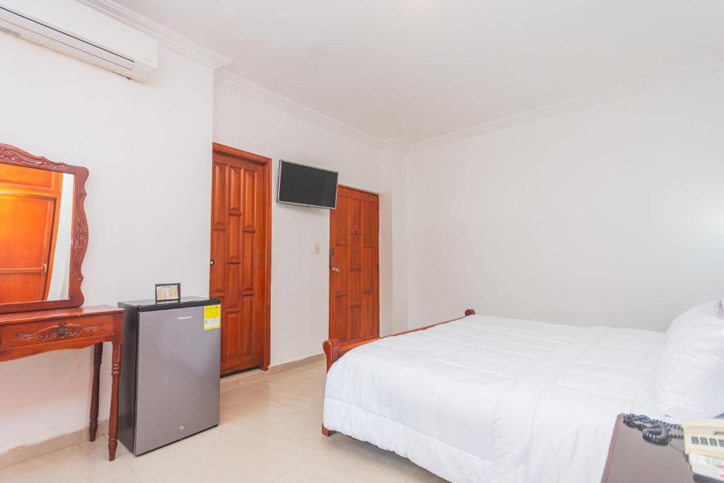 Postel nebo postele na pokoji v ubytování Hotel Baluarte Cartagena Boutique
