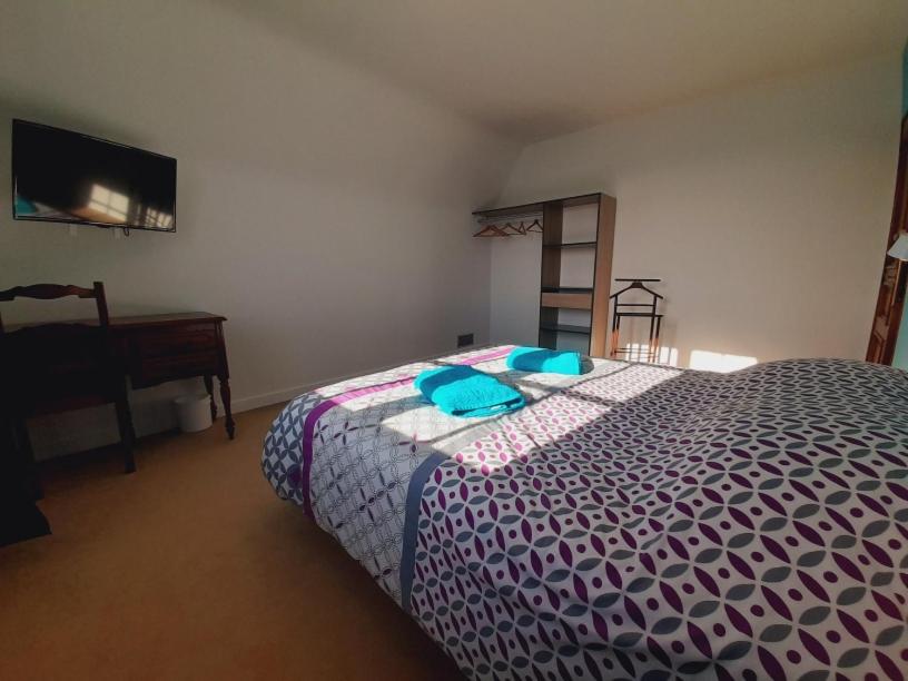 Postel nebo postele na pokoji v ubytování La Bonne Etoile - Chambres d'hôtes et Appartements -