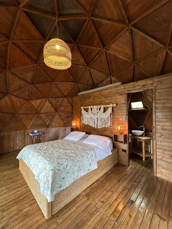 Postel nebo postele na pokoji v ubytování Tambo Eco Hotel
