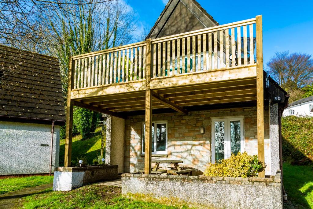 a wooden deck on top of a house at Valley Lodge 40 in Callington