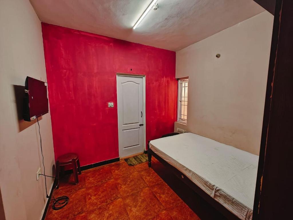 Postel nebo postele na pokoji v ubytování Lakshmi cottage