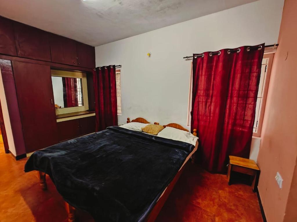 Postel nebo postele na pokoji v ubytování Lakshmi cottage