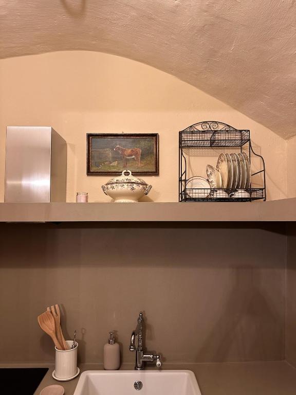 Kuchyň nebo kuchyňský kout v ubytování Lanternone nel Borgo - Appartamento di Charme con Giardino