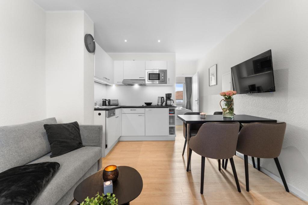 a living room with a couch and a table at Haus Klaus Lucky in Norderney