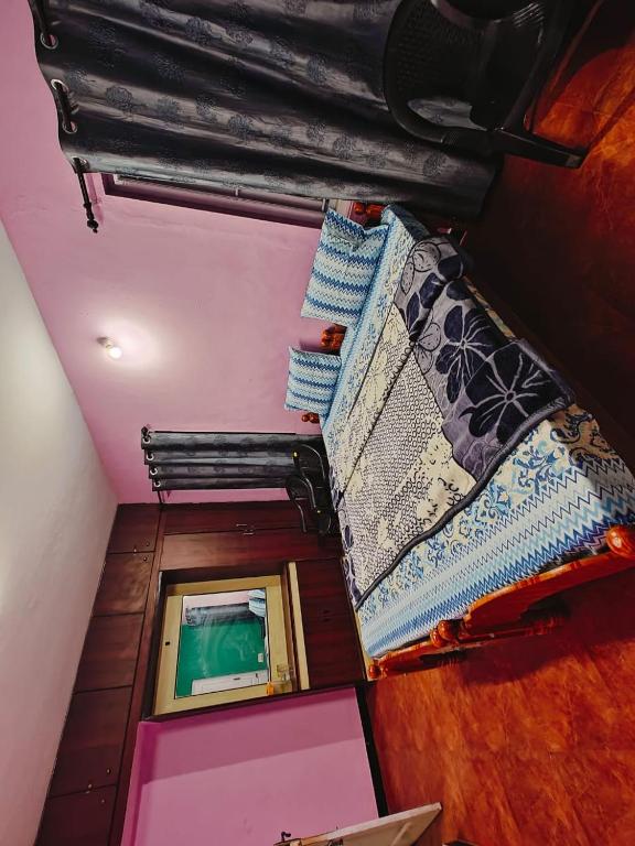 Postel nebo postele na pokoji v ubytování Lakshmi cottage