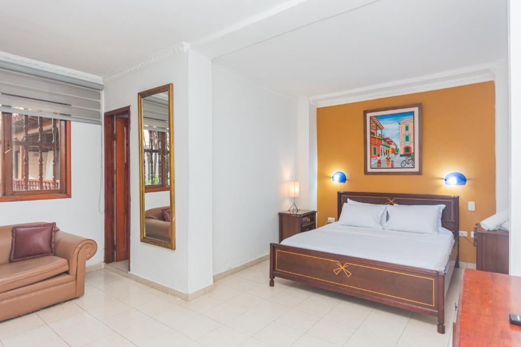 Postel nebo postele na pokoji v ubytování Hotel Baluarte Cartagena Boutique