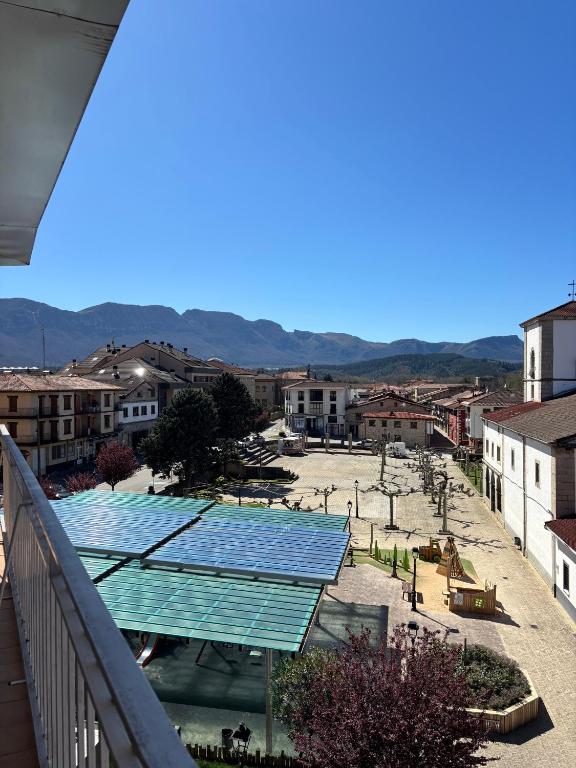 a view of a city with a bunch of solar panels at Céntrico espacioso y muy luminoso in Villasana de Mena