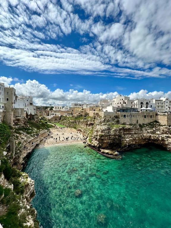 a view of a beach in a city with buildings at La Casa Al Mare in Polignano a Mare