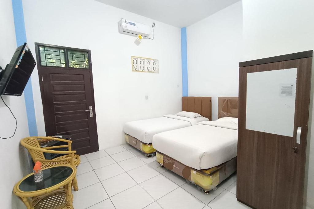 TV a/nebo společenská místnost v ubytování OYO 92207 Hotel Koperasi