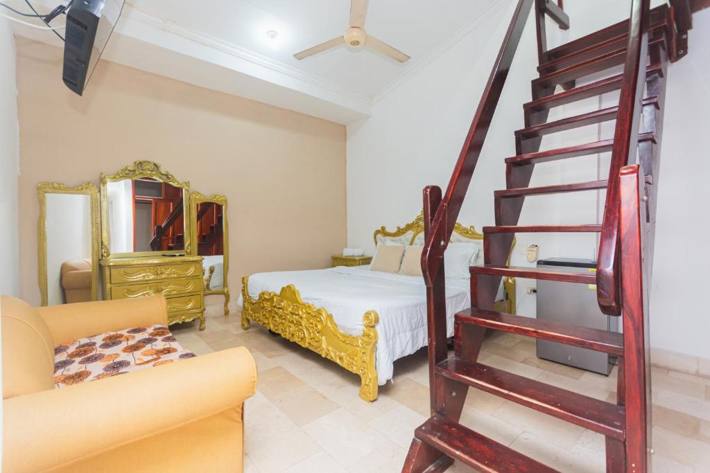 Postel nebo postele na pokoji v ubytování Hotel Baluarte Cartagena Boutique
