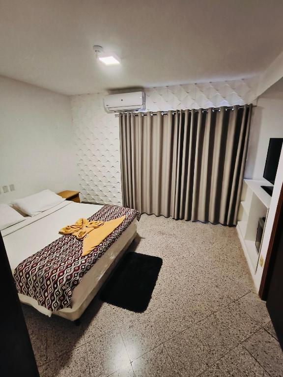 Postel nebo postele na pokoji v ubytování GRAN Parana SUITES HOTEL Asunción Centro