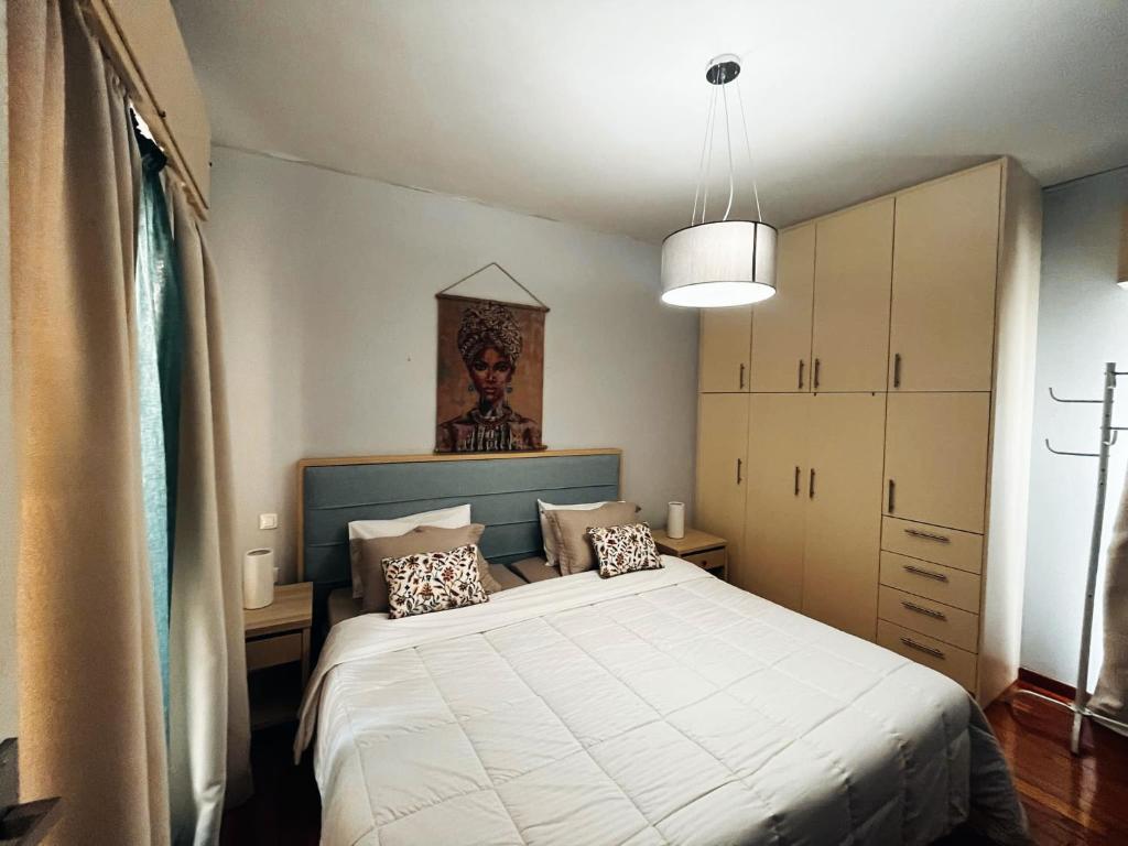 Posteľ alebo postele v izbe v ubytovaní Cozy apartment in centre of Heraklion