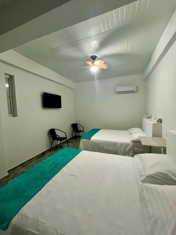 Postel nebo postele na pokoji v ubytování Hotel Guamaluno