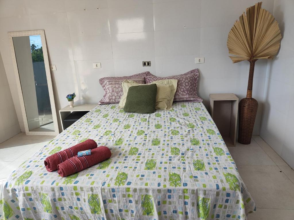 a bedroom with a bed with two pillows on it at Premium Apartment Double Bedroom in Cianorte