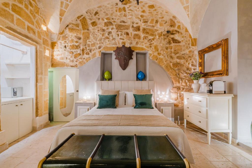 Postel nebo postele na pokoji v ubytování Relais La Casa del Poeta