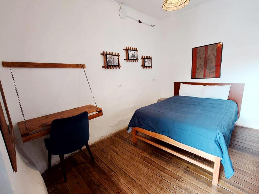 Letto o letti in una camera di Intro Hostels Cusco