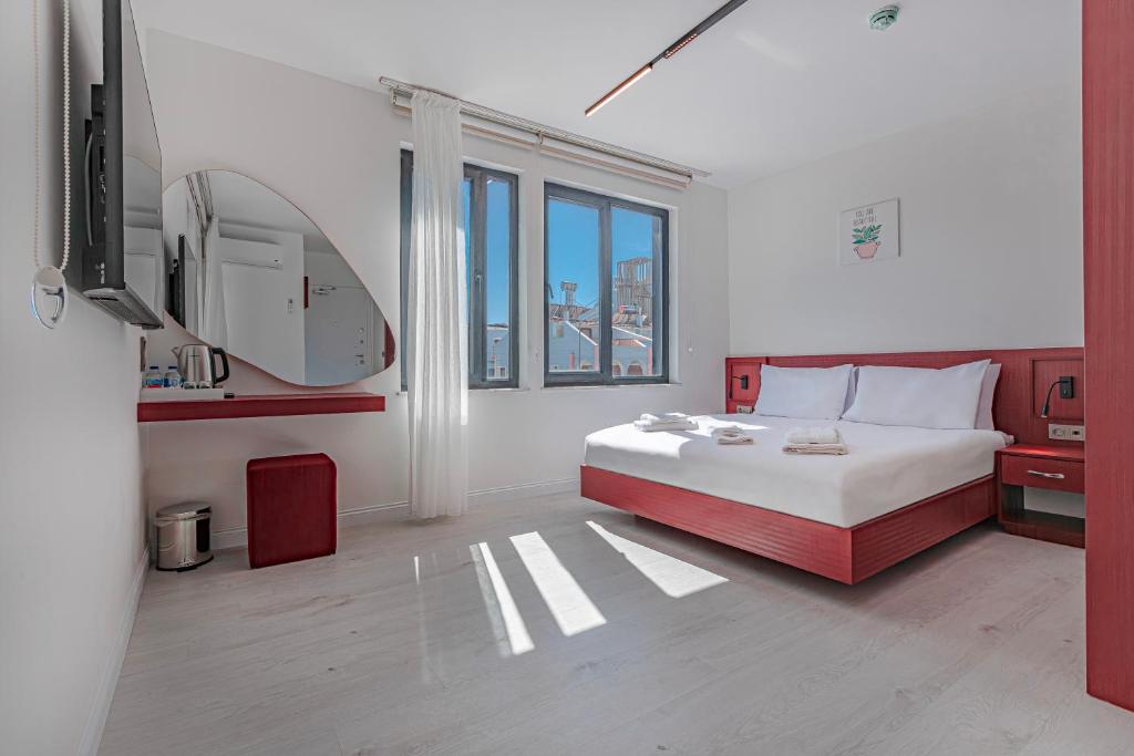 Postel nebo postele na pokoji v ubytování Tulii Rooms