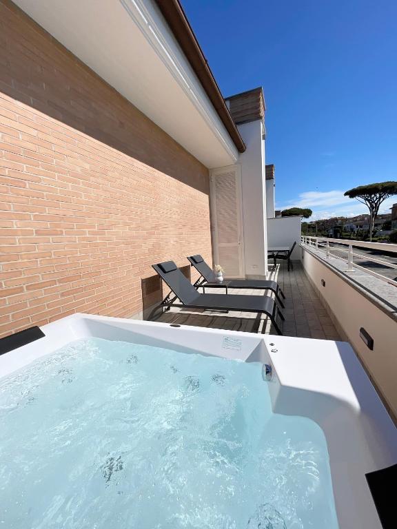 a hot tub on the balcony of a house at La Perla del Mare in Anzio