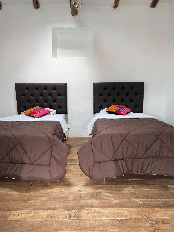 Postel nebo postele na pokoji v ubytování Auquis Hostel