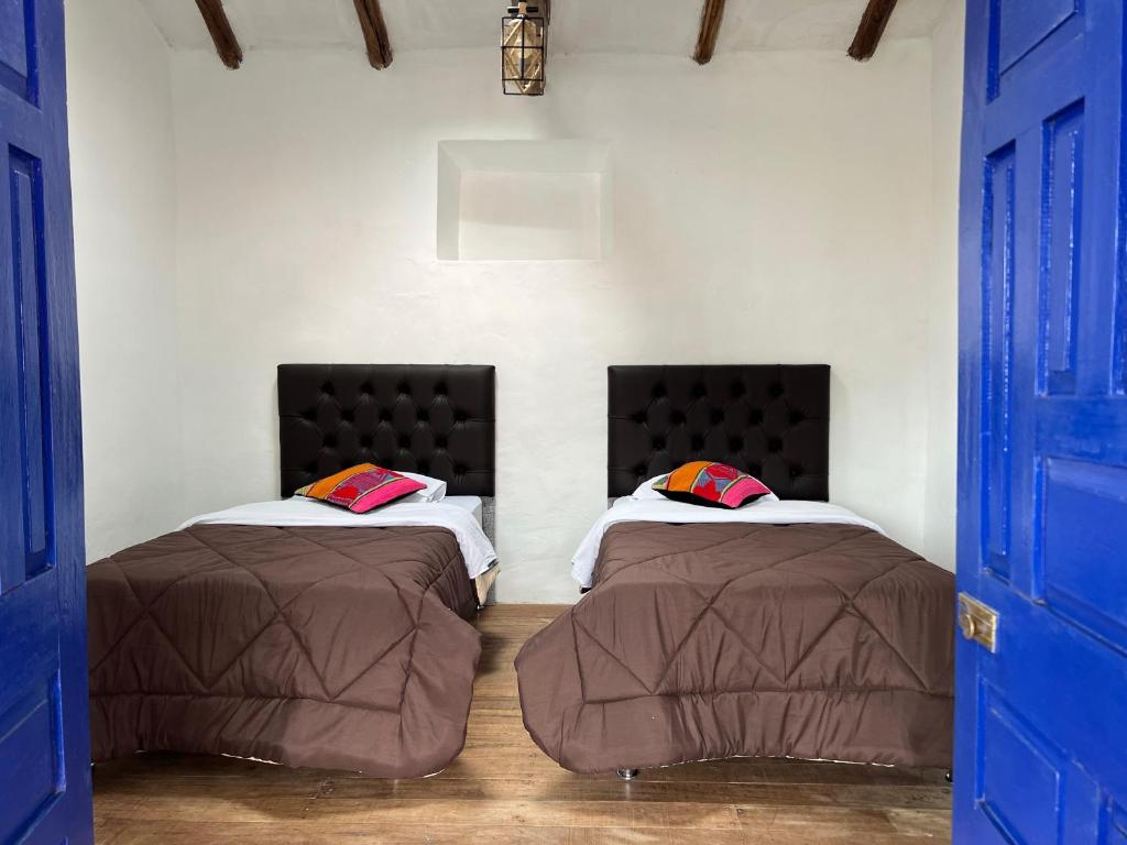 Postel nebo postele na pokoji v ubytování Auquis Hostel