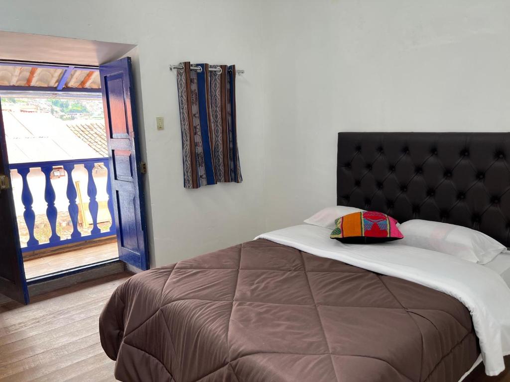 Postel nebo postele na pokoji v ubytování Auquis Hostel