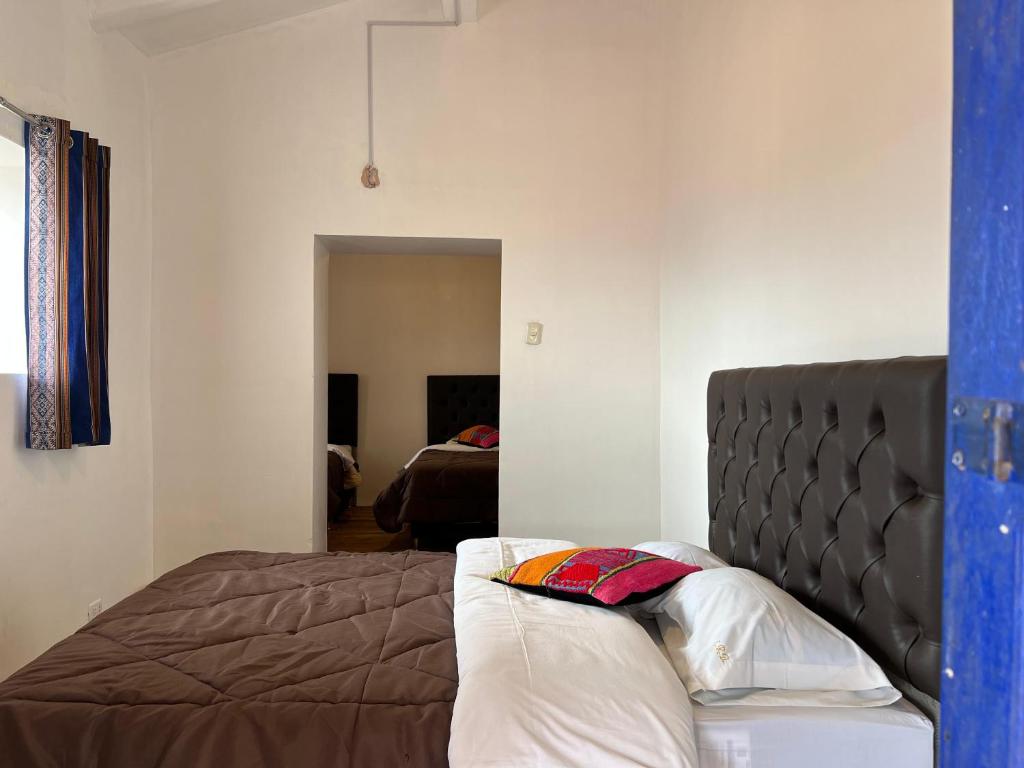 Postel nebo postele na pokoji v ubytování Auquis Hostel