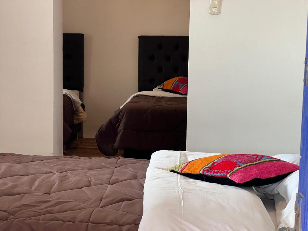 Postel nebo postele na pokoji v ubytování Auquis Hostel