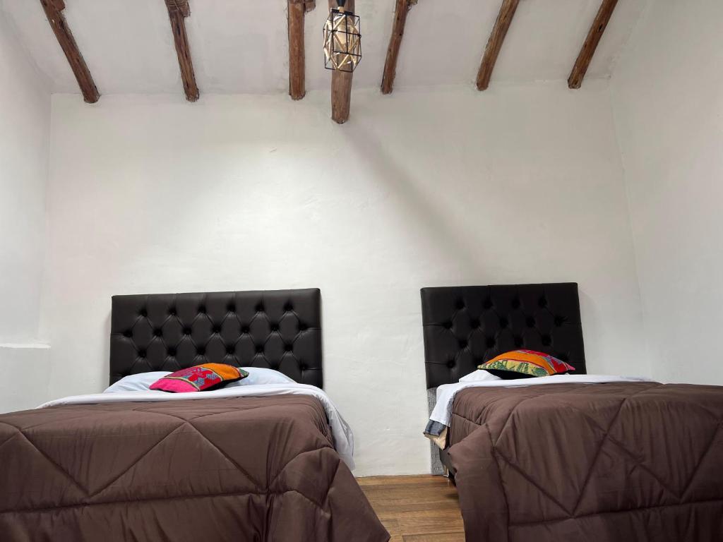Postel nebo postele na pokoji v ubytování Auquis Hostel