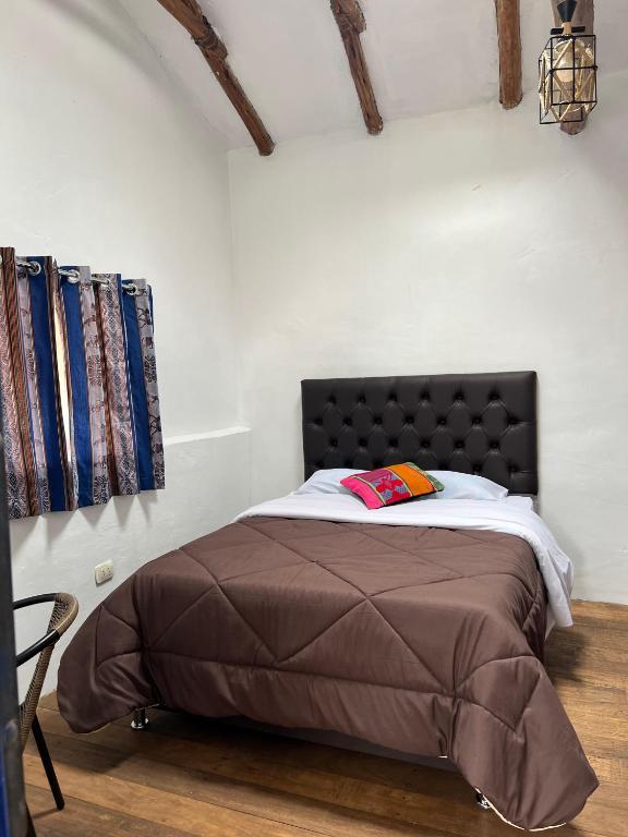 Postel nebo postele na pokoji v ubytování Auquis Hostel