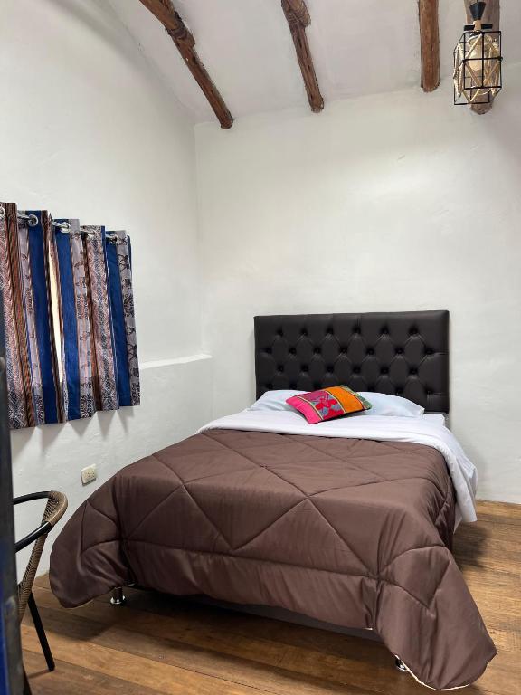 Postel nebo postele na pokoji v ubytování Auquis Hostel