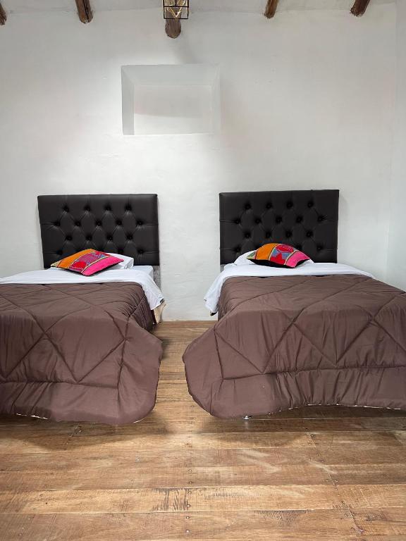 Postel nebo postele na pokoji v ubytování Auquis Hostel