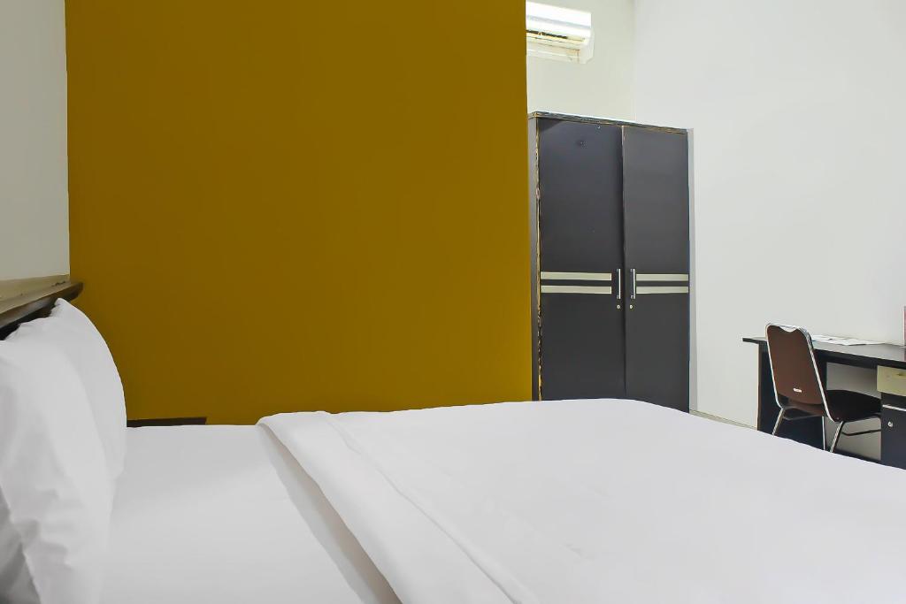 Postel nebo postele na pokoji v ubytování Collection O 92268 Hotel Aero