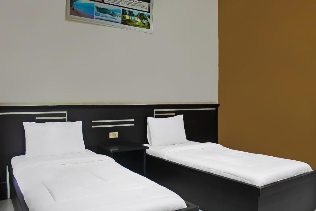 Postel nebo postele na pokoji v ubytování Collection O 92268 Hotel Aero