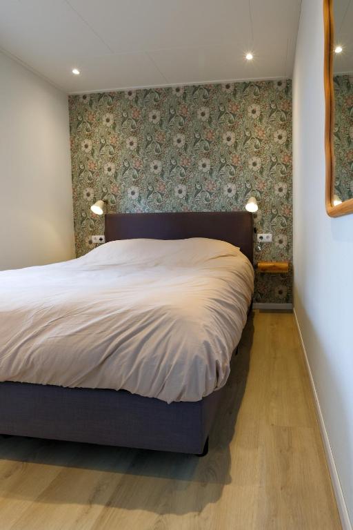Postel nebo postele na pokoji v ubytování Boshuisje - Bos en Bliss