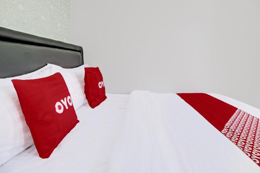 Postel nebo postele na pokoji v ubytování Super OYO Collection O 92363 Kp Inn