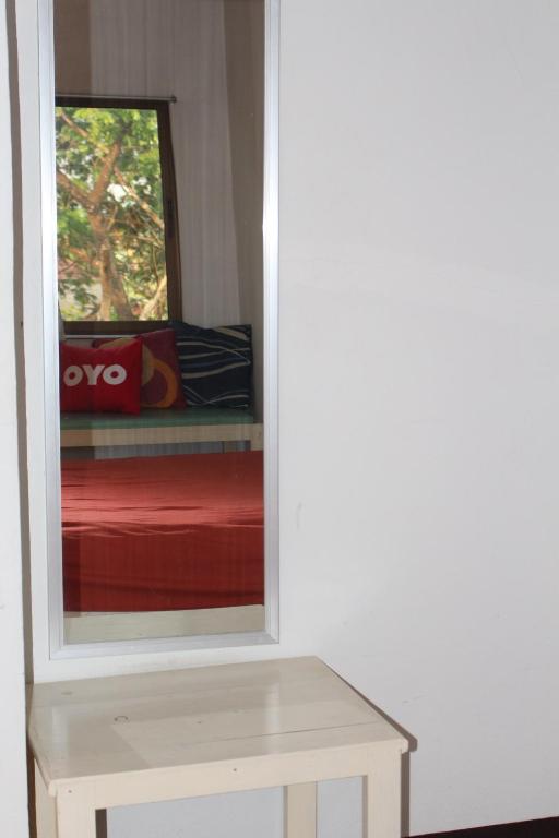 Postel nebo postele na pokoji v ubytování OYO 75420 Howto Hotel