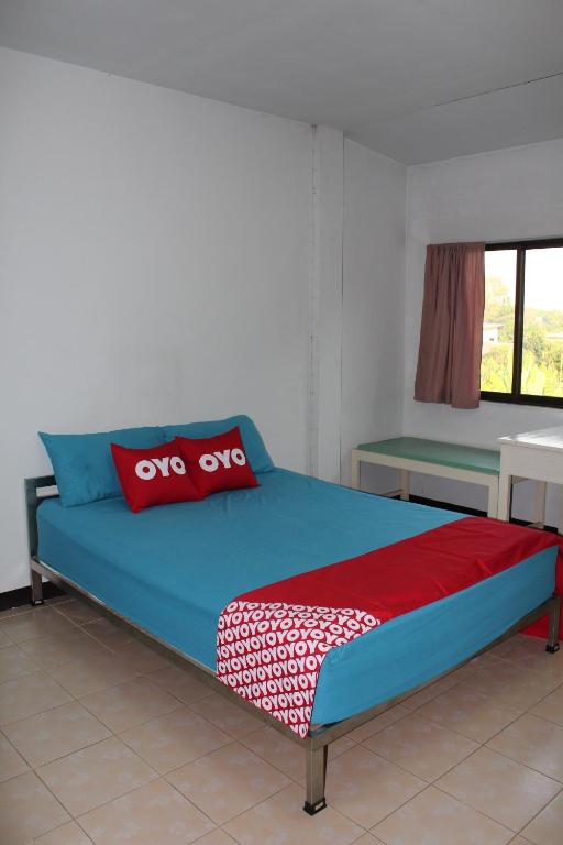Postel nebo postele na pokoji v ubytování OYO 75420 Howto Hotel