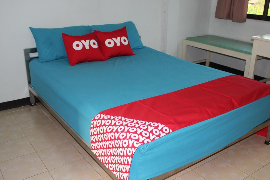 Postel nebo postele na pokoji v ubytování OYO 75420 Howto Hotel