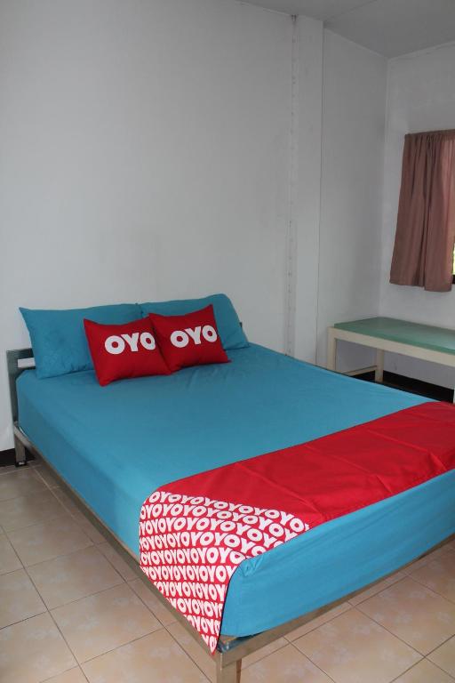 Postel nebo postele na pokoji v ubytování OYO 75420 Howto Hotel