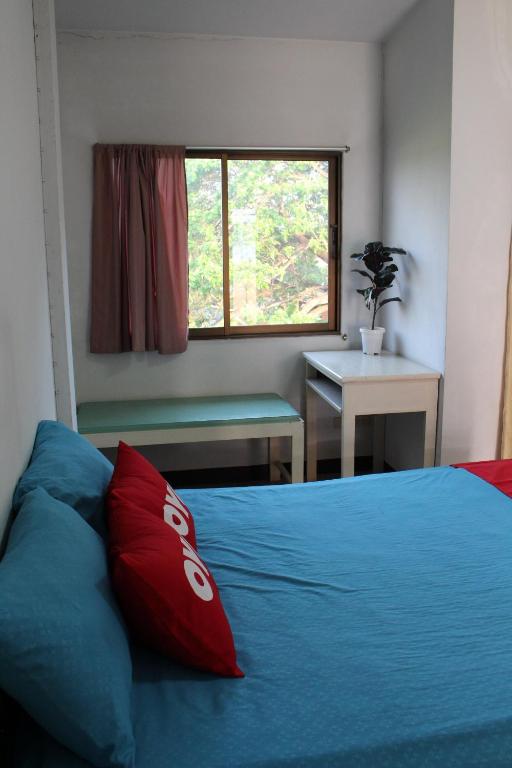 Postel nebo postele na pokoji v ubytování OYO 75420 Howto Hotel