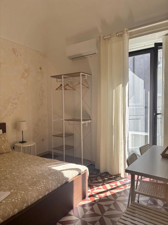 Posteľ alebo postele v izbe v ubytovaní Il Teatro Rooms
