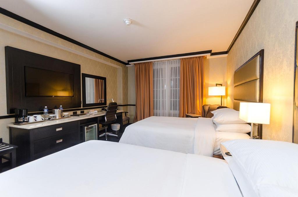 Postel nebo postele na pokoji v ubytování Hilton Princess San Pedro Sula