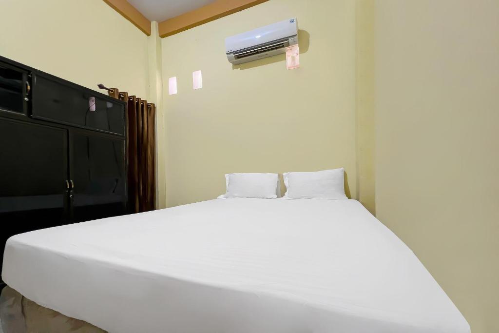 SPOT ON 92547 Wisma Dg Tata - Chambre Double