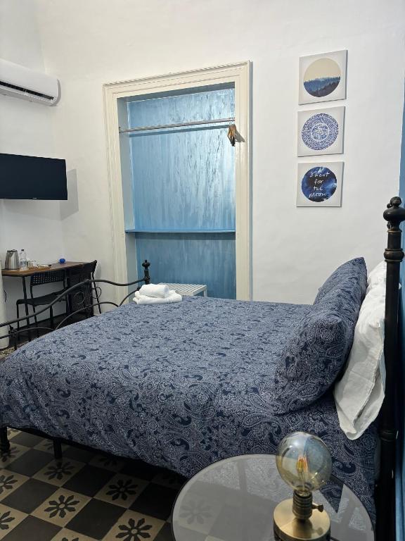 Posteľ alebo postele v izbe v ubytovaní Il Teatro Rooms