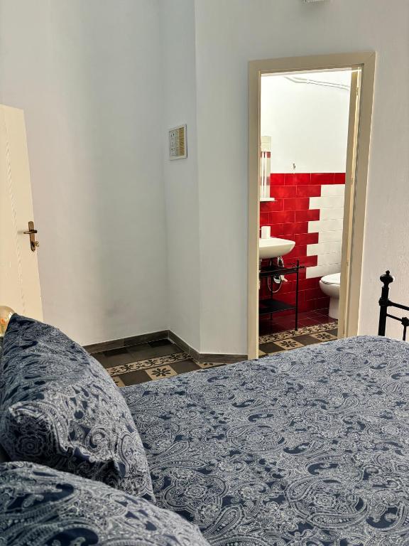 Posteľ alebo postele v izbe v ubytovaní Il Teatro Rooms