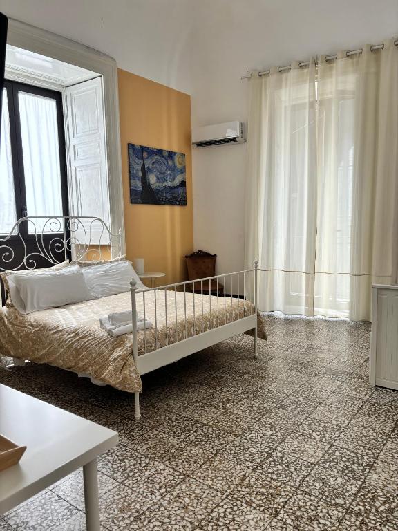 Posteľ alebo postele v izbe v ubytovaní Il Teatro Rooms