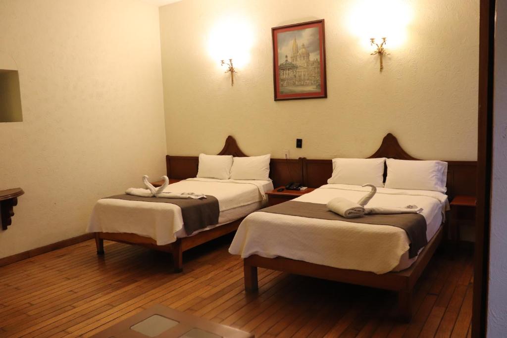 Postel nebo postele na pokoji v ubytování Hotel Frances