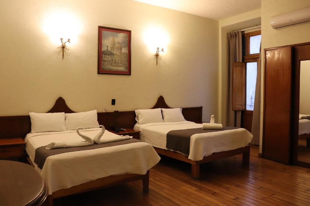 Postel nebo postele na pokoji v ubytování Hotel Frances